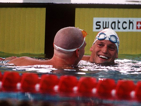 Canada's Jon Cleveland (right) competing in the men's breast stroke event at the 1996 Atlanta Summer Olympic Games. (CP PHOTO/COA/Mike Ridewood)