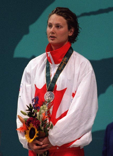 Canada's Marianne Limpert celebrates after winning the silver medal in the women's swimming event at the 1996 Atlanta Olympic Games. (CP Photo/ COA/ Claus Andersen)