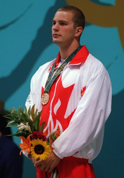 Canada's Curtis Myden received the gold medal for the fastest time in the swimming event at the 1996 Atlanta Summer Olympic Games. (CP PHOTO/COA/Mike Ridewood)