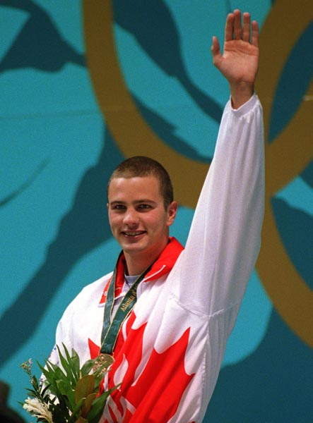 Canada's Curtis Myden received the gold medal for the fastest time in the swimming event at the 1996 Atlanta Summer Olympic Games. (CP PHOTO/COA/Mike Ridewood)