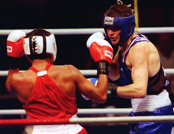 Canada's Mike Strange (blue) boxing against his opponent at the 1996 Atlanta Summer Olympic Games. (CP PHOTO/COA/Scott Grant)