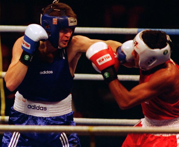 Canada's Mike Strange (blue) in action boxing against his opponent at the 1996 Atlanta Summer Olympic Games. (CP PHOTO/COA/Scott Grant)