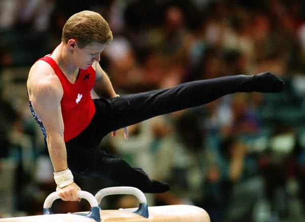 Canada's Kris Burley competing in the gymnastics event at the 1996 Atlanta Summer Olympic Games. (CP PHOTO/COA/Scott Grant)