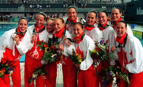 Canada's Synchronized Swimming team celebrate the silver medal they won at the 1996 Atlanta Summer Olympic Games. (CP PHOTO/COA/Scott Grant)