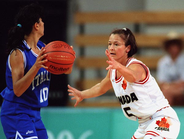 Canada's Karla Karch (right )playing women's basketball at the 1996 Atlanta Summer Olympic Games. (CP PHOTO/COA/Mike Ridewood)
