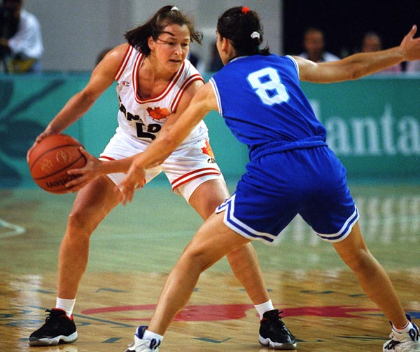 Canada's Karla Karch (left)  playing women's basketball at the 1996 Atlanta Summer Olympic Games. (CP PHOTO/COA/Mike Ridewood)