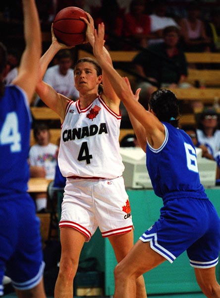 Canada's Bev Smith (white jersey) playing women's basketball at the 1996 Atlanta Summer Olympic Games. (CP PHOTO/COA/Scott Grant)