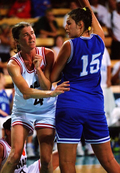 Canada's Bev Smith (white jersey) playing women's basketball at the 1996 Atlanta Summer Olympic Games. (CP PHOTO/COA/Scott Grant)