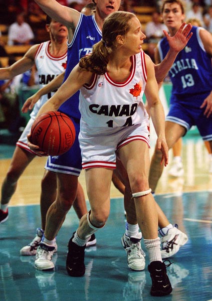 Canada's Andrea Blackwell (white jersey) playing women's basketball at the 1996 Atlanta Summer Olympic Games. (CP PHOTO/COA/Mike Ridewood)