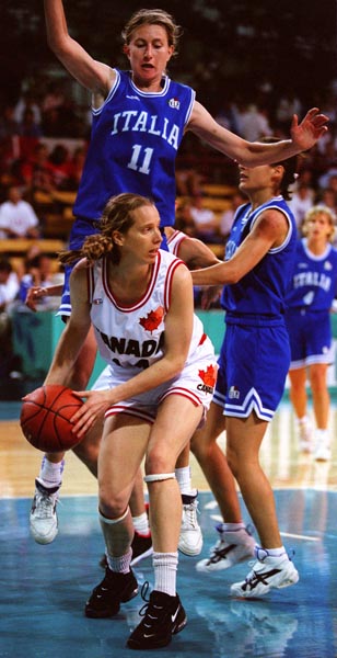 Canada's Andrea Blackwell (white jersey) playing women's basketball at the 1996 Atlanta Summer Olympic Games. (CP PHOTO/COA/Mike Ridewood)