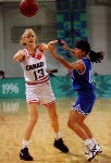 Canada's Kelly Boucher (white jersey) playing women's basketball at the 1996 Atlanta Summer Olympic Games. (CP PHOTO/COA/Mike Ridewood)