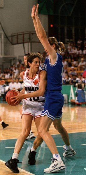Canada's Cynthia Johnston (white jersey) playing women's basketball at the 1996 Atlanta Summer Olympic Games. (CP PHOTO/COA/Mike Ridewood)