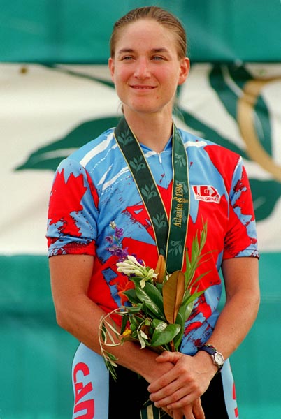 Canada's Alison Sydor celebrates her silver medal she won for the women's cross country cycling event at the 1996 Atlanta Summer Olympic Games. (CP PHOTO/COA/Mike Ridewood)