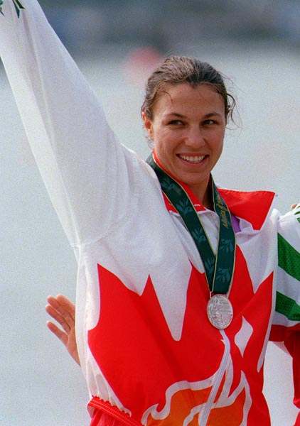 Canada's Caroline Brunet celebrates the silver medal she won in the K-1 kayak event at the 1996 Atlanta Summer Olympic Games. (CP PHOTO/COA/Mike RIdewood)