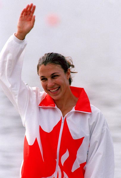Canada's Caroline Brunet celebrates the silver medal she won in the K-1 kayak event at the 1996 Atlanta Summer Olympic Games. (CP PHOTO/COA/Mike RIdewood)