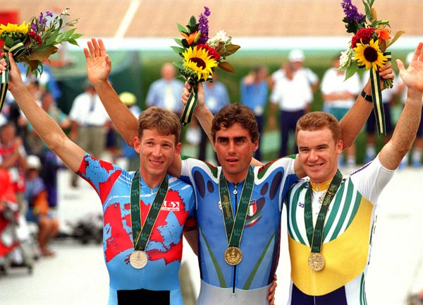 Canada's Brian Walton (left) celebrates the silver medal he won for the points race cycling event at the 1996 Atlanta Summer Olympic Games. (CP PHOTO/COA/Mike Ridewood)