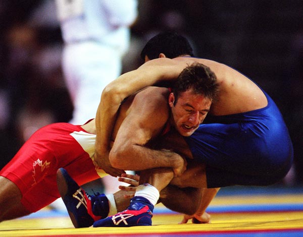 Canada's David Hohl (red) competing in the wrestling event at the 1996 Atlanta Summer Olympic Games. (CP PHOTO/COA/Scott Grant)