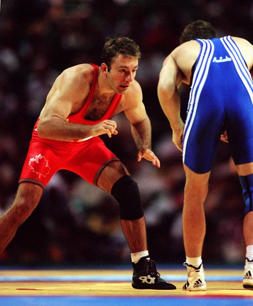 Canada's David Hohl (red) competing in the wrestling event at the 1996 Atlanta Summer Olympic Games. (CP PHOTO/COA/Scott Grant)