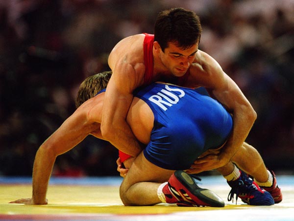 Canada's Guivi Sissaouri competing in the wrestling event at the 1996 Atlanta Summer Olympic Games. (CP PHOTO/COA/Claus Andersen)