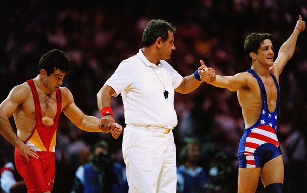 Canada's Guivi Sissaouri (left) lost the gold medal in the wrestling event to American  Kendall Cross at the 1996 Atlanta Summer Olympic Games. (CP PHOTO/COA/Claus Andersen)