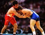 Canada's Marty Caulder (red) competes in the wrestling event at the 1996 Atlanta Olympic Games. (CP Photo/COA/Mike Ridewood)