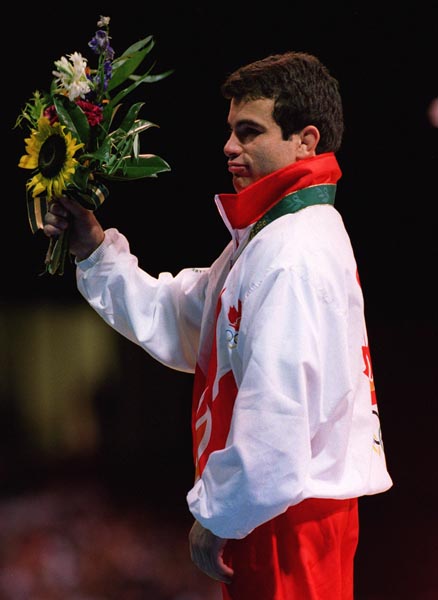 Canada's Guivi Sissaouri celebrates his silver medal win in the wrestling event at the 1996 Atlanta Summer Olympic Games. (CP PHOTO/COA/Claus Andersen)