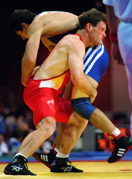 Canada's Scott Bianco (red) competing in the wrestling event at the 1996 Atlanta Summer Olympic Games. (CP PHOTO/COA/Scott Grant)