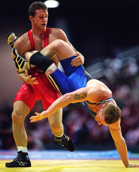 Canada's Craig Roberts (red) competing in the wrestling event at the 1996 Atlanta Summer Olympic Games. (CP PHOTO/COA/Claus Andersen)