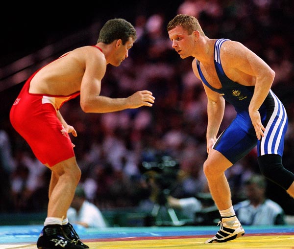 Canada's Craig Roberts (left) competing in the wrestling event at the 1996 Atlanta Summer Olympic Games. (CP PHOTO/COA/Claus Andersen)