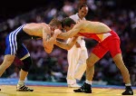 Canada's Craig Roberts (red) competes in the wrestling event at the 1996 Atlanta Olympic Games. (CP Photo/COA/Mike Ridewood)