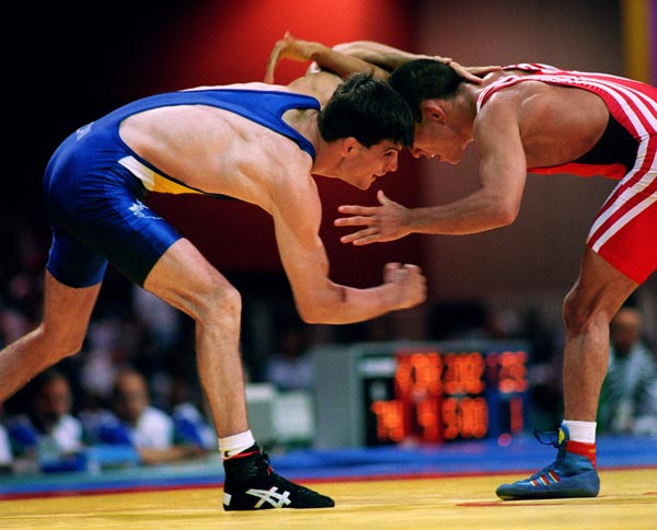 Canada's Greg Woodcroft (blue) competing in the wrestling event at the 1996 Atlanta Summer Olympic Games. (CP PHOTO/COA/Scott Grant0