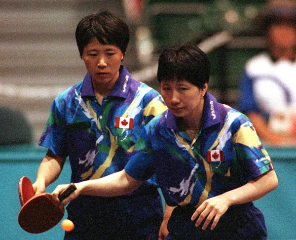 Canada's Lijuan Geng (left) and Barbara Chiu in action  during the table tennis event at the 1996 Atlanta Summer Olympic Games. (CP PHOTO/COA/Scott Grant)