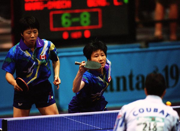 Canada's Lijuan Geng (l) and Barbara Chiu in action against their opponents during the table tennis event at the 1996 Atlanta Summer Olympic Games. (CP PHOTO/COA/Scott Grant)
