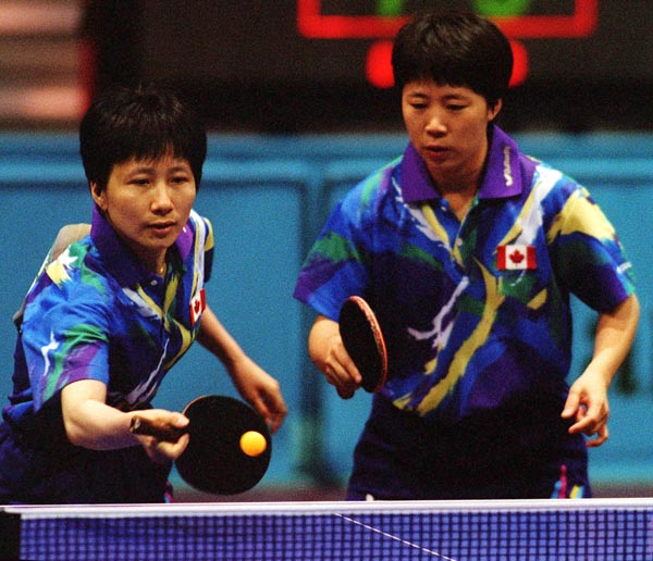 Canada's Barbara Chiu (left) and Lijuan Geng in action against their opponents during the table tennis event at the 1996 Atlanta Summer Olympic Games. (CP PHOTO/COA/Scott Grant)