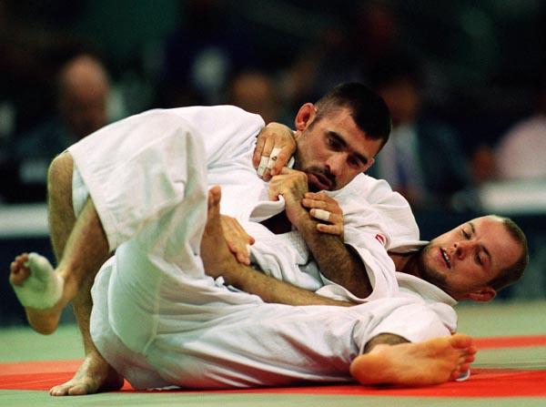 Canada's Nicolas Gill (front) competing in the Judo event at the 1996 Atlanta Summer Olympic Games. (CP PHOTO/COA/Scott Grant)