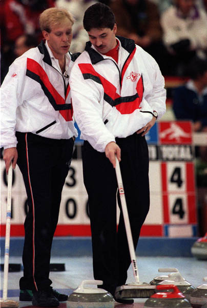 Canada's Kevin Park (right) and Kevin Martin competing in the curling event at the 1992 Albertville Olympic winter Games. (CP PHOTO/COA/Ted Grant)