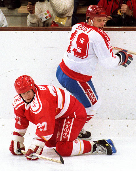 Canada's Todd Brost (top) competing in the Gold Medal game against the Unified Team in which Canada won Silver at the 1992 Albertville Olympic winter Games. (CP PHOTO/COA/Scott Grant)