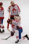 Canada's Sean Burke (goalie) and Eric Lindros shows their disappointment after losing the Gold Medal game against the Unified Team in which Canada won Silver at the 1992 Albertville Olympic winter Games. (CP PHOTO/COA/Scott Grant)