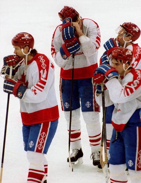 (From Left) Canada's Kent Manderville, Eric Lindros, Curt Giles and Jason Wooley show their disappointment after losing the Gold Medal game against the Unified Team in which Canada won Silver at the 1992 Albertville Olympic winter Games. (CP PHOTO/COA/Sco
