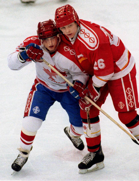 Canada's Fabian Joseph (left) competing in the Gold Medal game against the Unified Team in which Canada won Silver at the 1992 Albertville Olympic winter Games. (CP PHOTO/COA/Scott Grant)