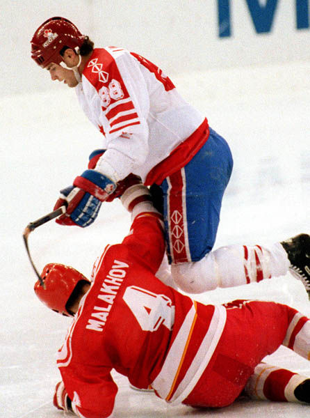 Canada's Eric Lindros (top) competing in the Gold Medal game against the Unified Team in which Canada won Silver at the 1992 Albertville Olympic winter Games. (CP PHOTO/COA/Scott Grant)