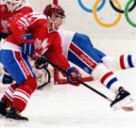 Canada's Curt Giles competing in the Gold Medal game against the Unified Team in which Canada won Silver at the 1992 Albertville Olympic winter Games. (CP PHOTO/COA/Scott Grant)