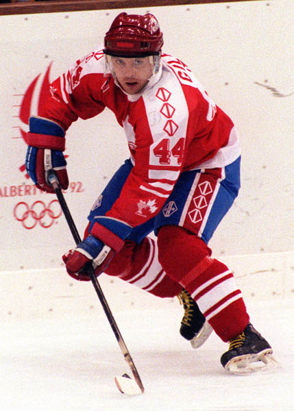 Canada's Curt Giles competing in the hockey event against France at the 1992 Albertville Olympic winter Games. (CP PHOTO/COA/Scott Grant)