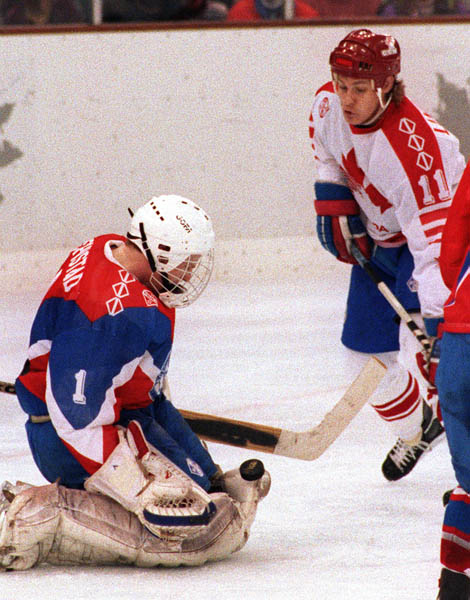 Canada's Chris Lindberg (right) competing in the hockey event against Norway at the 1992 Albertville Olympic winter Games. (CP PHOTO/COA/Scott Grant)