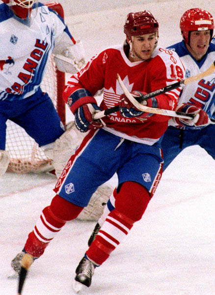 Canada's Kent Manderville (left) competing in the hockey event against France at the 1992 Albertville Olympic winter Games. (CP PHOTO/COA/Scott Grant)