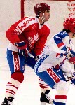 Canada's Brad Schlegel (foreground) and Sean Burke (goalie) competing in the hockey event against France at the 1992 Albertville Olympic winter Games. (CP PHOTO/COA/Scott Grant)