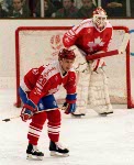 Canada's Brad Schlegel (foreground) and Sean Burke (goalie) competing in the hockey event against France at the 1992 Albertville Olympic winter Games. (CP PHOTO/COA/Scott Grant)