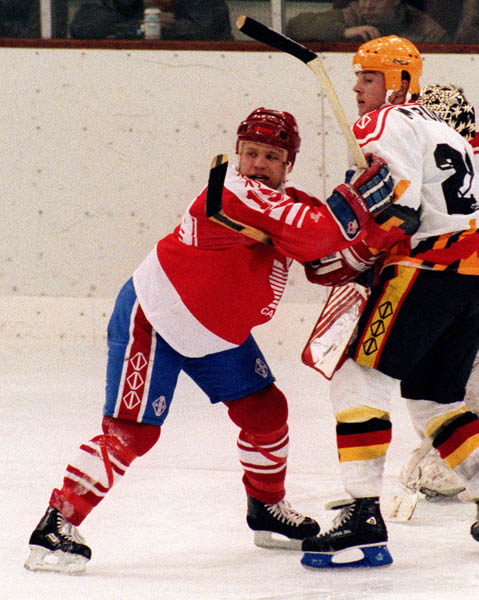 Canada's Todd Brost (left) competing in the hockey event against Germany at the 1992 Albertville Olympic winter Games. (CP PHOTO/COA/Scott Grant)