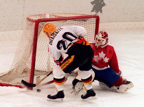 Canada's Sean Burke (goalie) competing in the hockey event against Germany at the 1992 Albertville Olympic winter Games. (CP PHOTO/COA/Scott Grant)