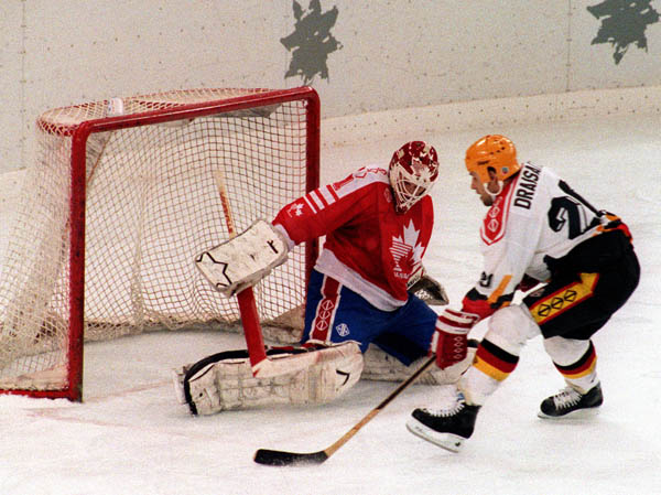 Canada's Sean Burke (goalie) competing in the hockey event against Germany at the 1992 Albertville Olympic winter Games. (CP PHOTO/COA/Scott Grant)